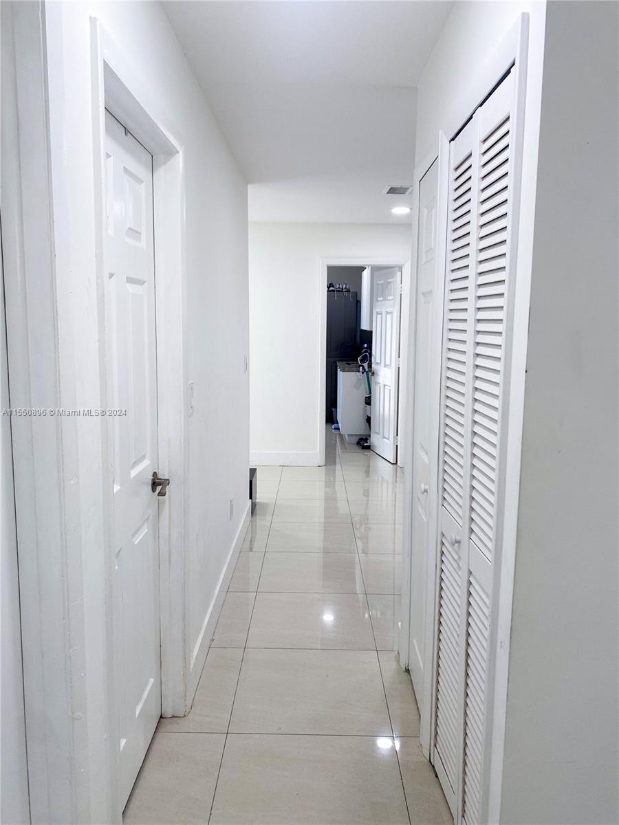 11032 Southwest 5th Street Sweetwater, FL 33174 - Photo 13 of 24 a view of entryway with bathroom