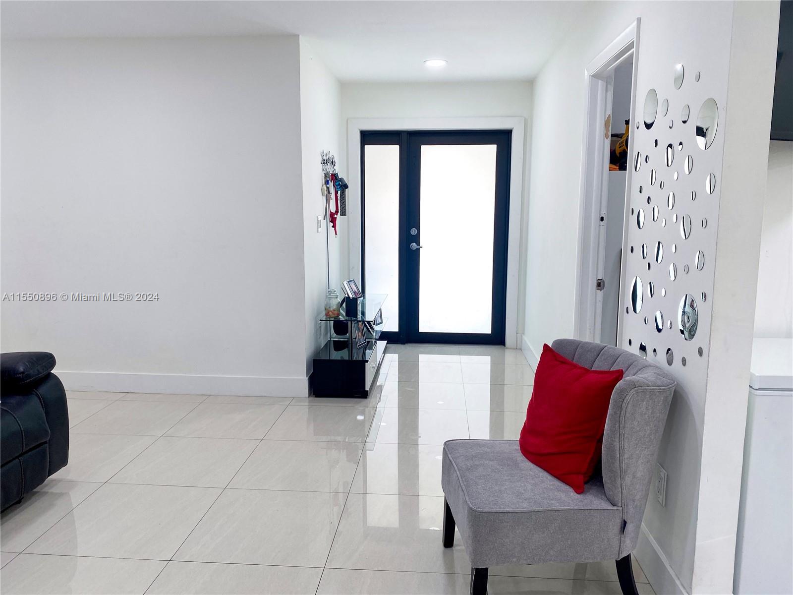 11032 Southwest 5th Street Sweetwater, FL 33174 - Photo 15 of 24 a living room with furniture and a couch