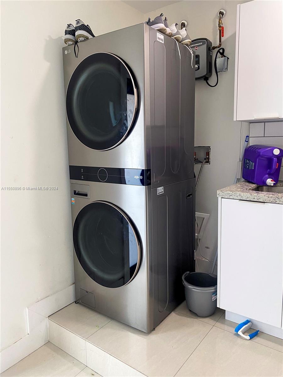 11032 Southwest 5th Street Sweetwater, FL 33174 - Photo 21 of 24 a utility room with dryer and washer