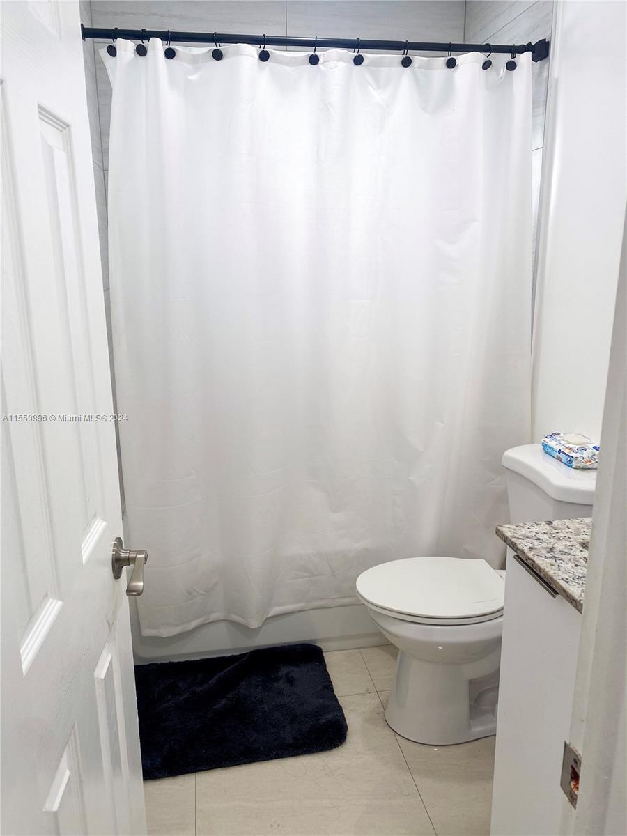 11032 Southwest 5th Street Sweetwater, FL 33174 - Photo 4 of 24 a bathroom with a sink and a toilet