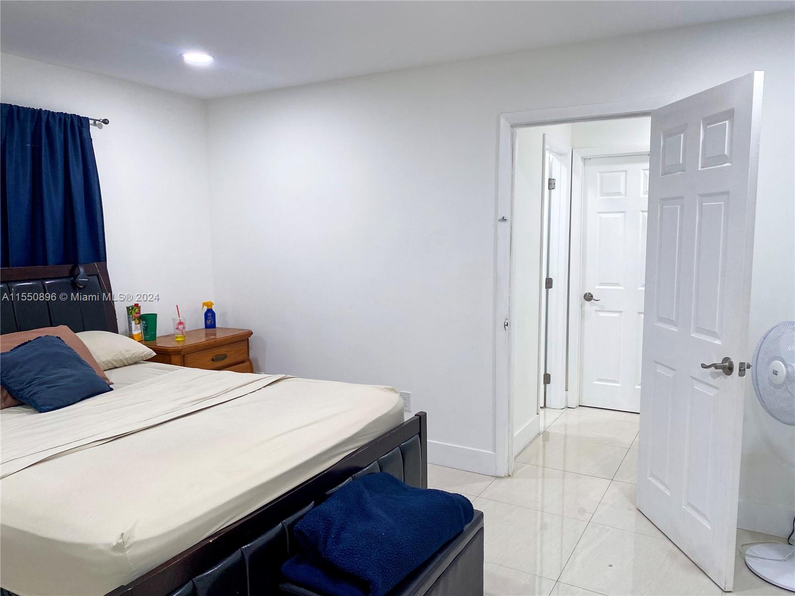 11032 Southwest 5th Street Sweetwater, FL 33174 - Photo 8 of 24 a bedroom with a bed and a dresser