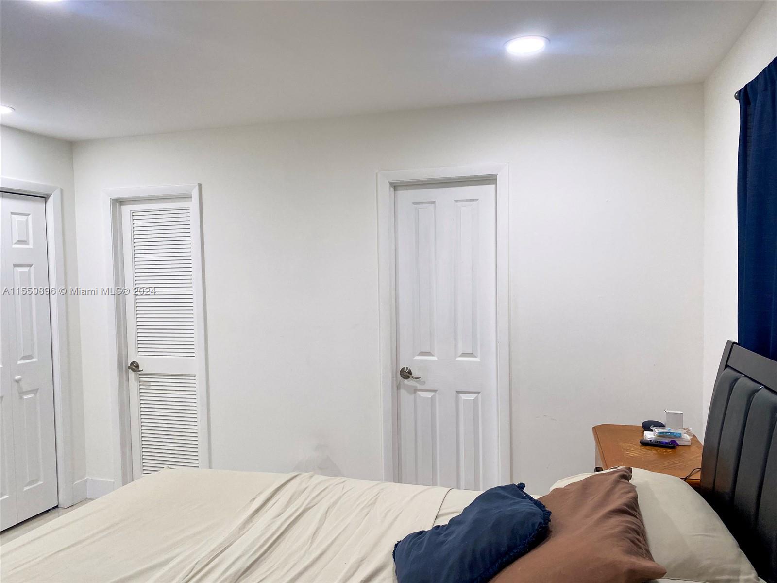 11032 Southwest 5th Street Sweetwater, FL 33174 - Photo 10 of 24 a bedroom with a bed and a closet