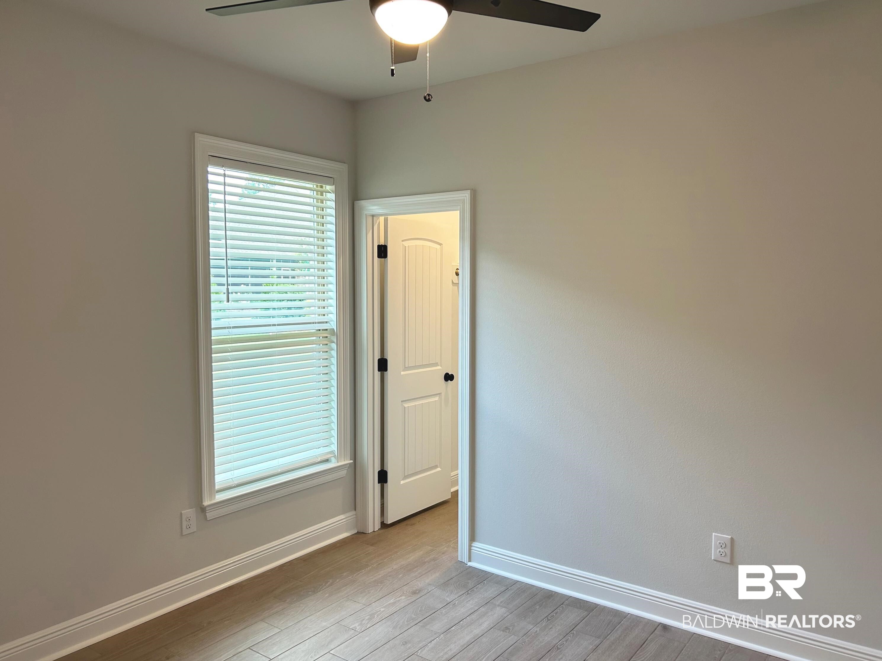 860 Sumter Loop Foley, AL 36535 - Photo 18 of 26 Unfurnished room featuring light wood-type flooring and ceiling fan