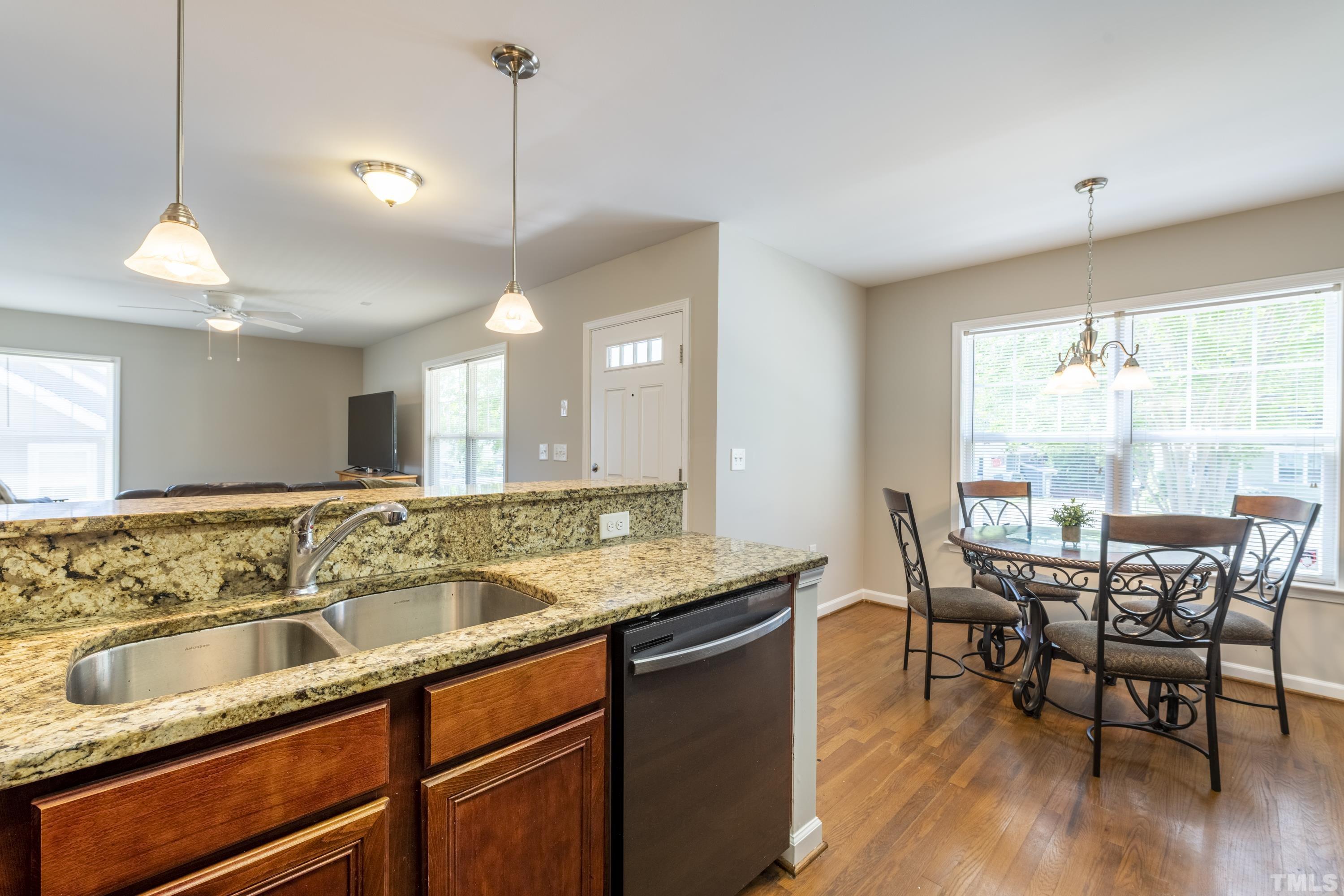 1119 South State Street Raleigh, NC 27601 - Photo 7 of 35 a view of a kitchen with granite countertop lots of counter space and dining table