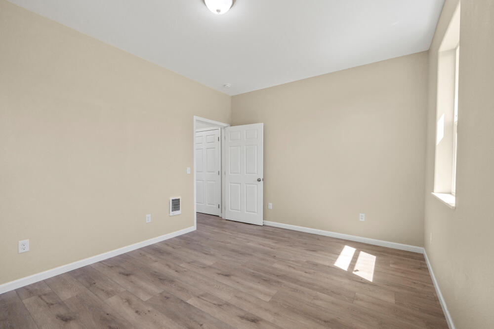 330 North Elm Street Merrill, OR 97633 - Photo 11 of 23 a view of an empty room with wooden floor