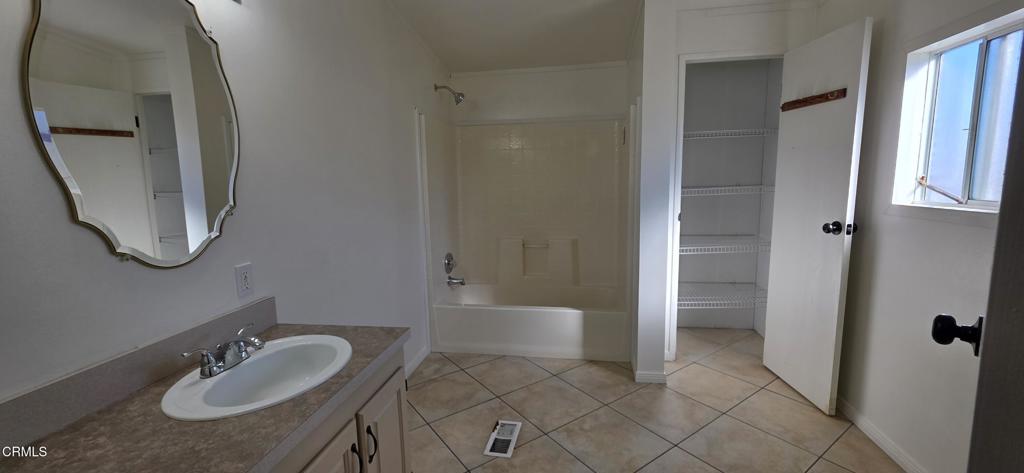 1645 Lime Avenue, Unit 91 Oxnard, CA 93033 - Photo 11 of 17 a bathroom with a sink and a mirror