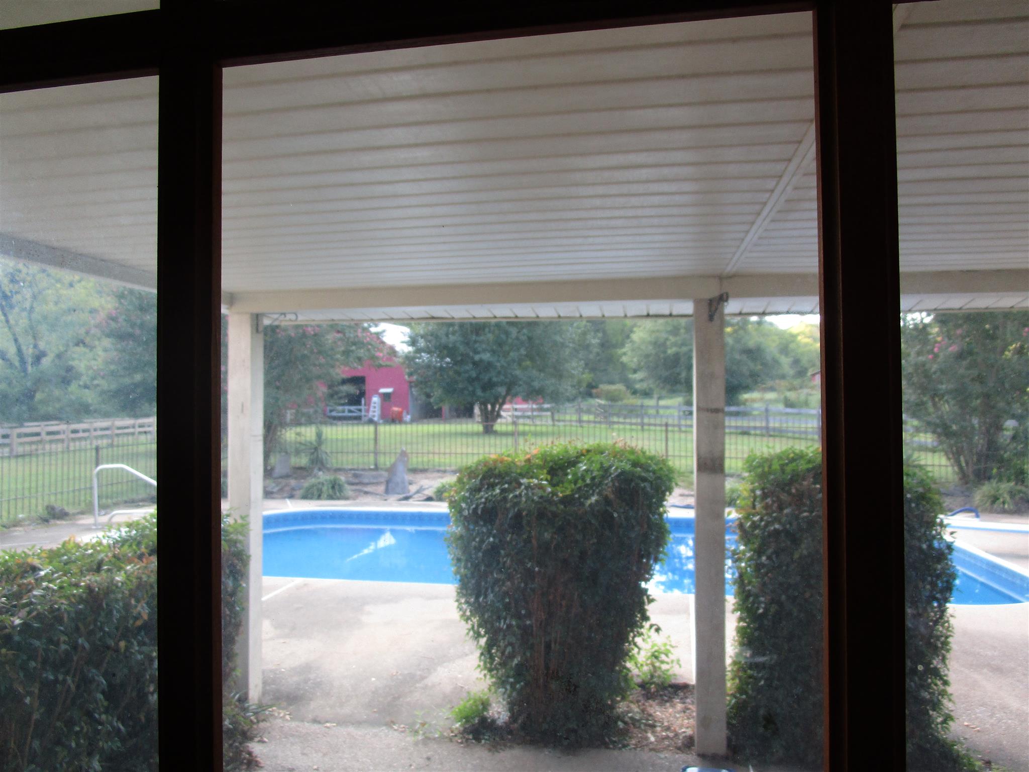 4020 Stella Road Prospect, TN 38477 - Photo 12 of 27 a view of a porch with dining table and chairs