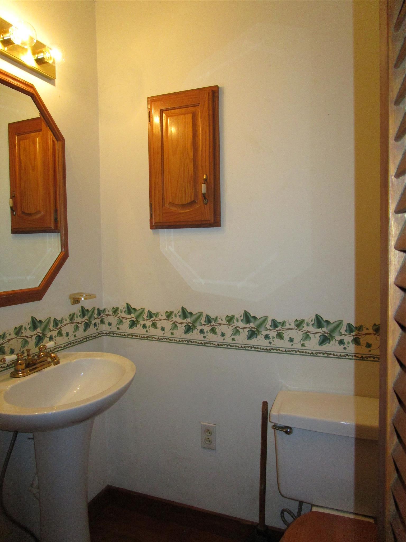 4020 Stella Road Prospect, TN 38477 - Photo 15 of 27 a bathroom with a sink mirror and vanity