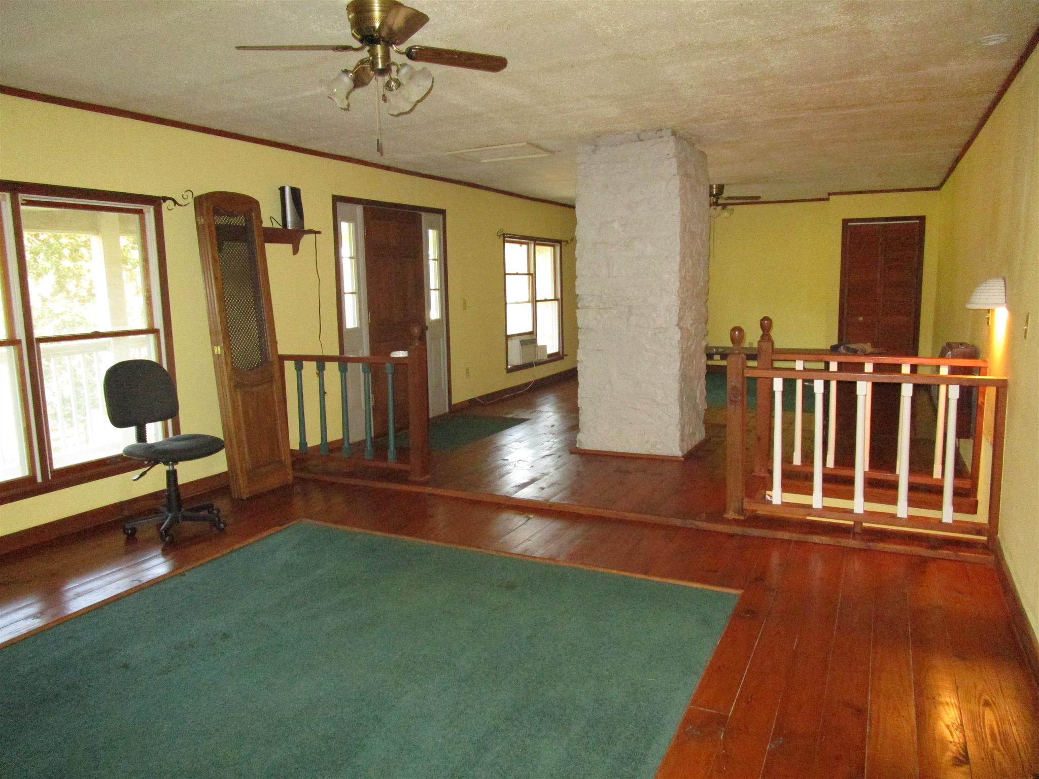 4020 Stella Road Prospect, TN 38477 - Photo 25 of 27 a living room with furniture floor to ceiling window and wooden floor