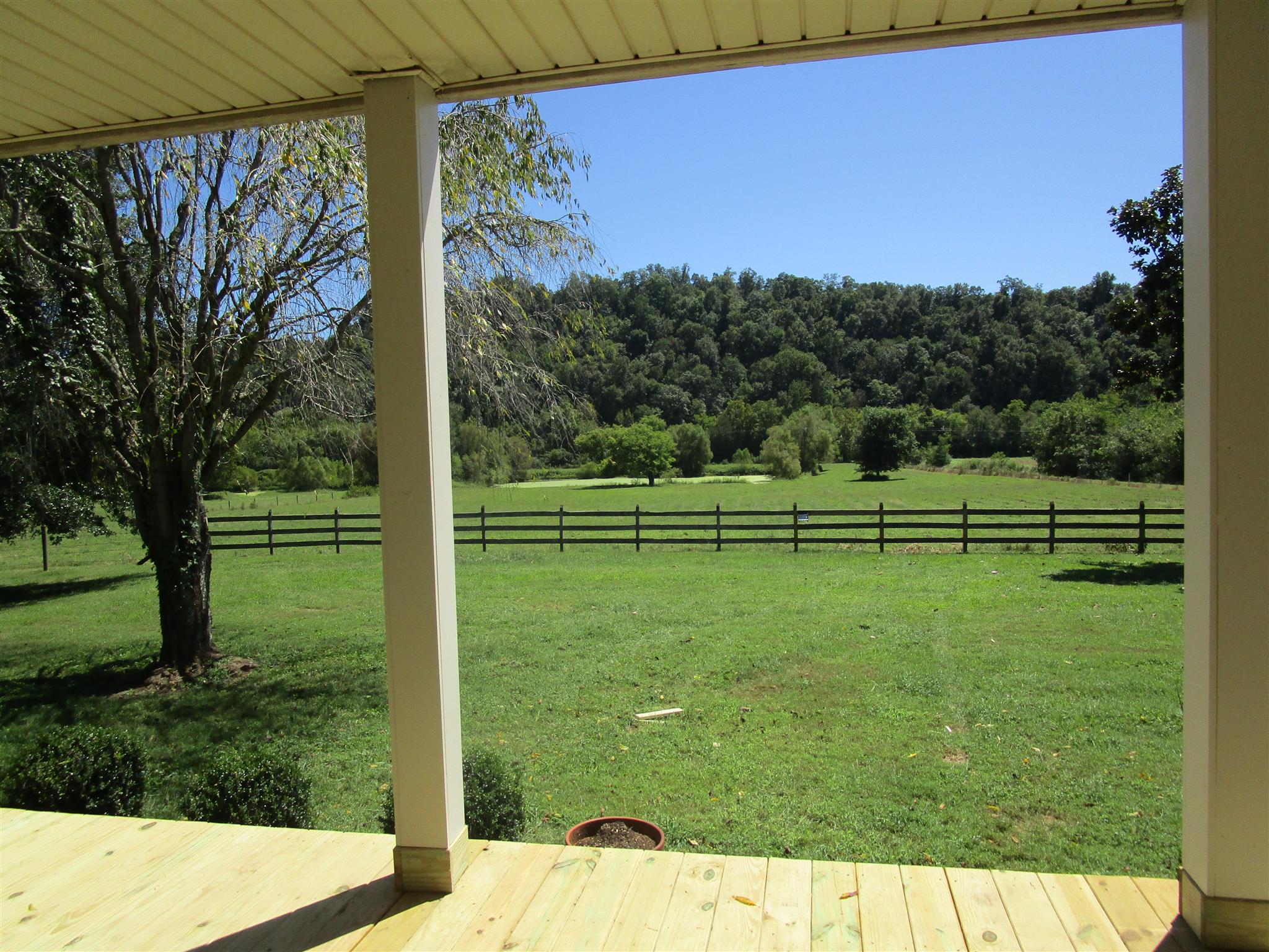 4020 Stella Road Prospect, TN 38477 - Photo 6 of 27 a view of a golf ground with huge green field and large trees