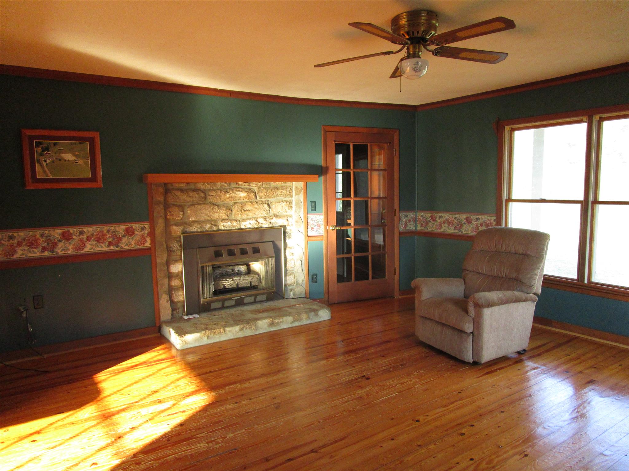 4020 Stella Road Prospect, TN 38477 - Photo 7 of 27 a living room with fireplace furniture and a flat screen tv
