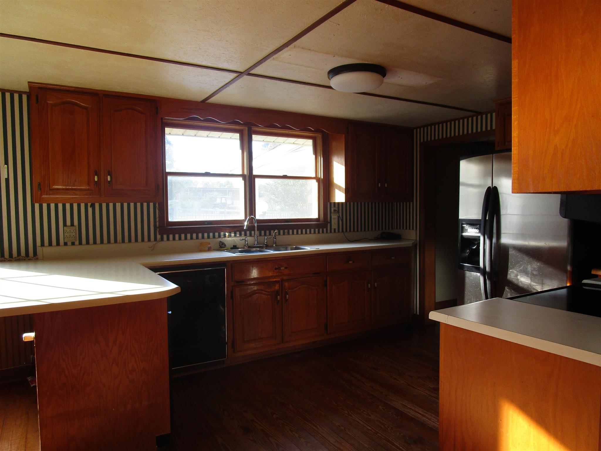 4020 Stella Road Prospect, TN 38477 - Photo 9 of 27 a kitchen with stainless steel appliances granite countertop a sink a stove and a refrigerator