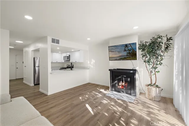 a view of a living room a fireplace and entryway