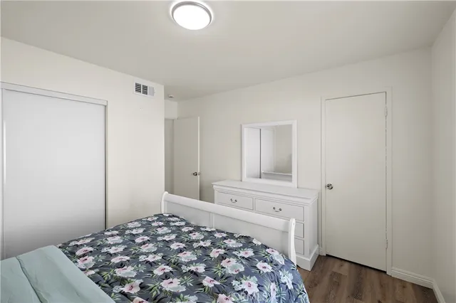 a bedroom with a bed and a cabinets