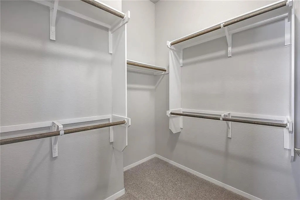 116 River Hills Drive Georgetown, TX 78628 - Photo 16 of 19 a view of a room with racks on the wall