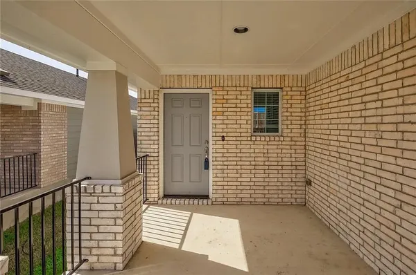 a view of a porch with a door
