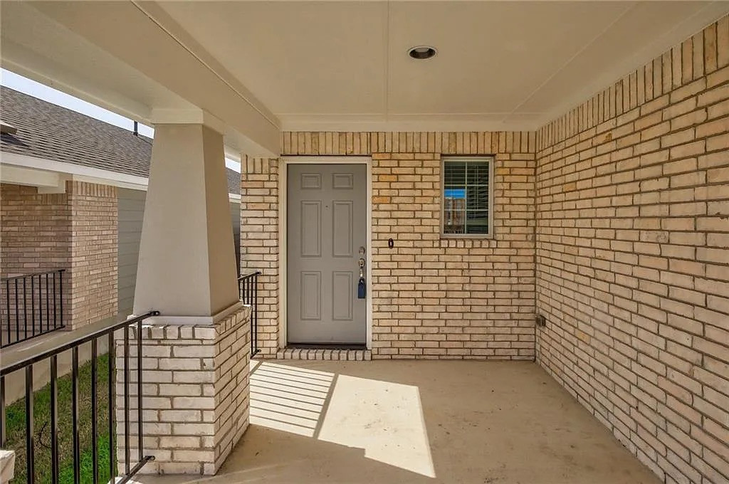 116 River Hills Drive Georgetown, TX 78628 - Photo 4 of 19 a view of a porch with a door