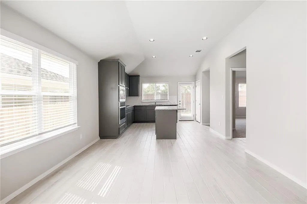 116 River Hills Drive Georgetown, TX 78628 - Photo 7 of 19 a view of a kitchen with a sink and cabinets