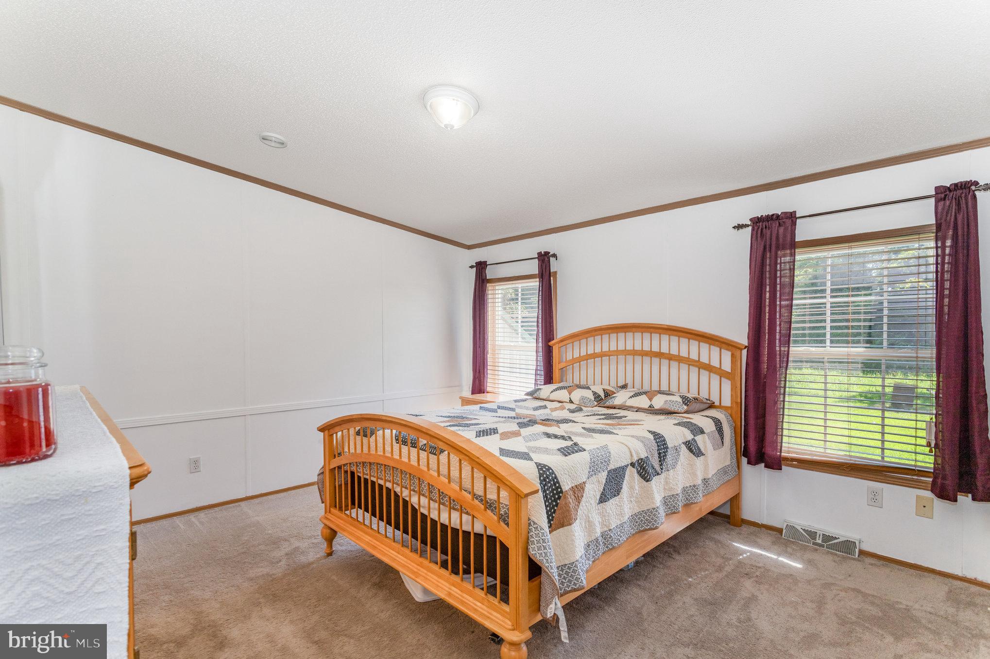 1050 Lisburn Road Wellsville, PA 17365 - Photo 15 of 35 a bedroom with a bed and a window