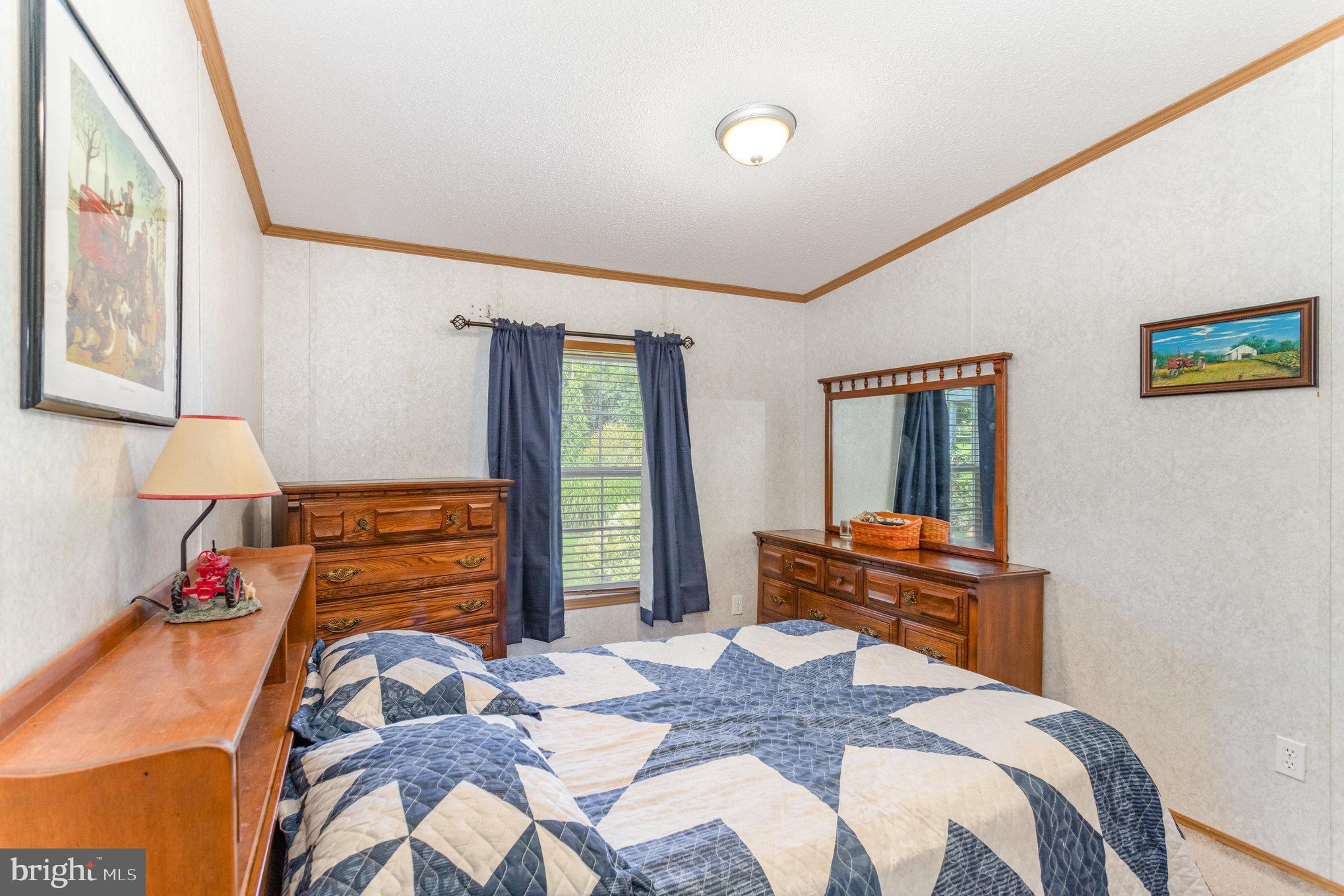 1050 Lisburn Road Wellsville, PA 17365 - Photo 19 of 35 a bedroom with a bed and wooden floor