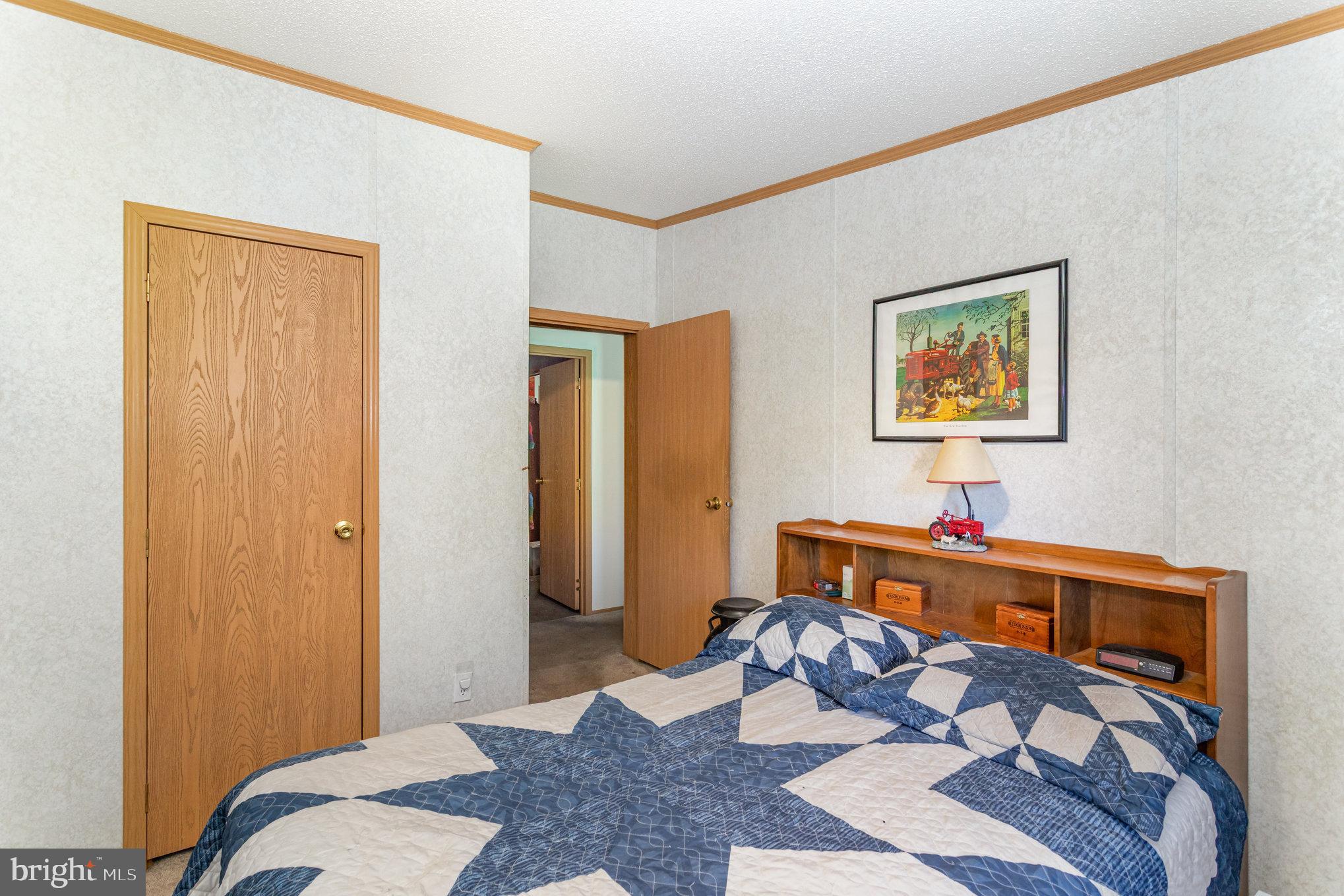 1050 Lisburn Road Wellsville, PA 17365 - Photo 20 of 35 a bedroom with a bed and a dresser in it
