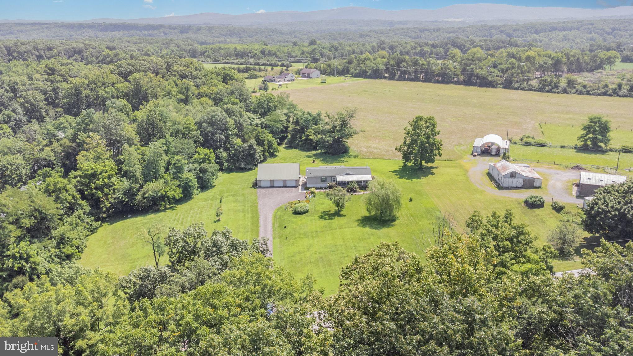 1050 Lisburn Road Wellsville, PA 17365 - Photo 2 of 35 a view of a lake with mountains in the background