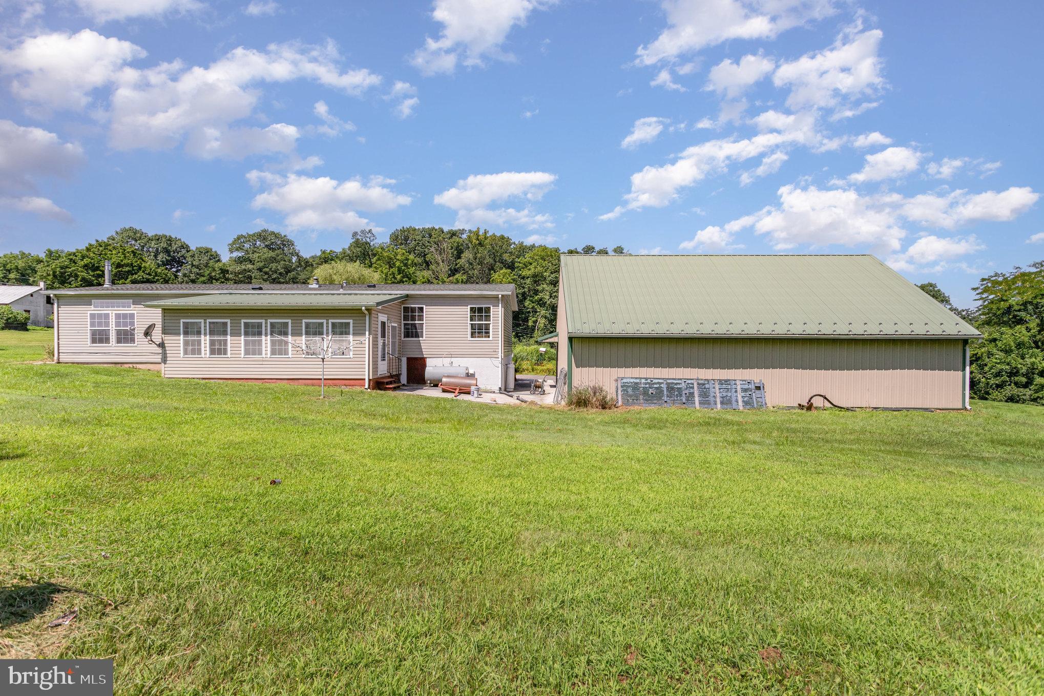 1050 Lisburn Road Wellsville, PA 17365 - Photo 27 of 35 a view of a big yard with a house