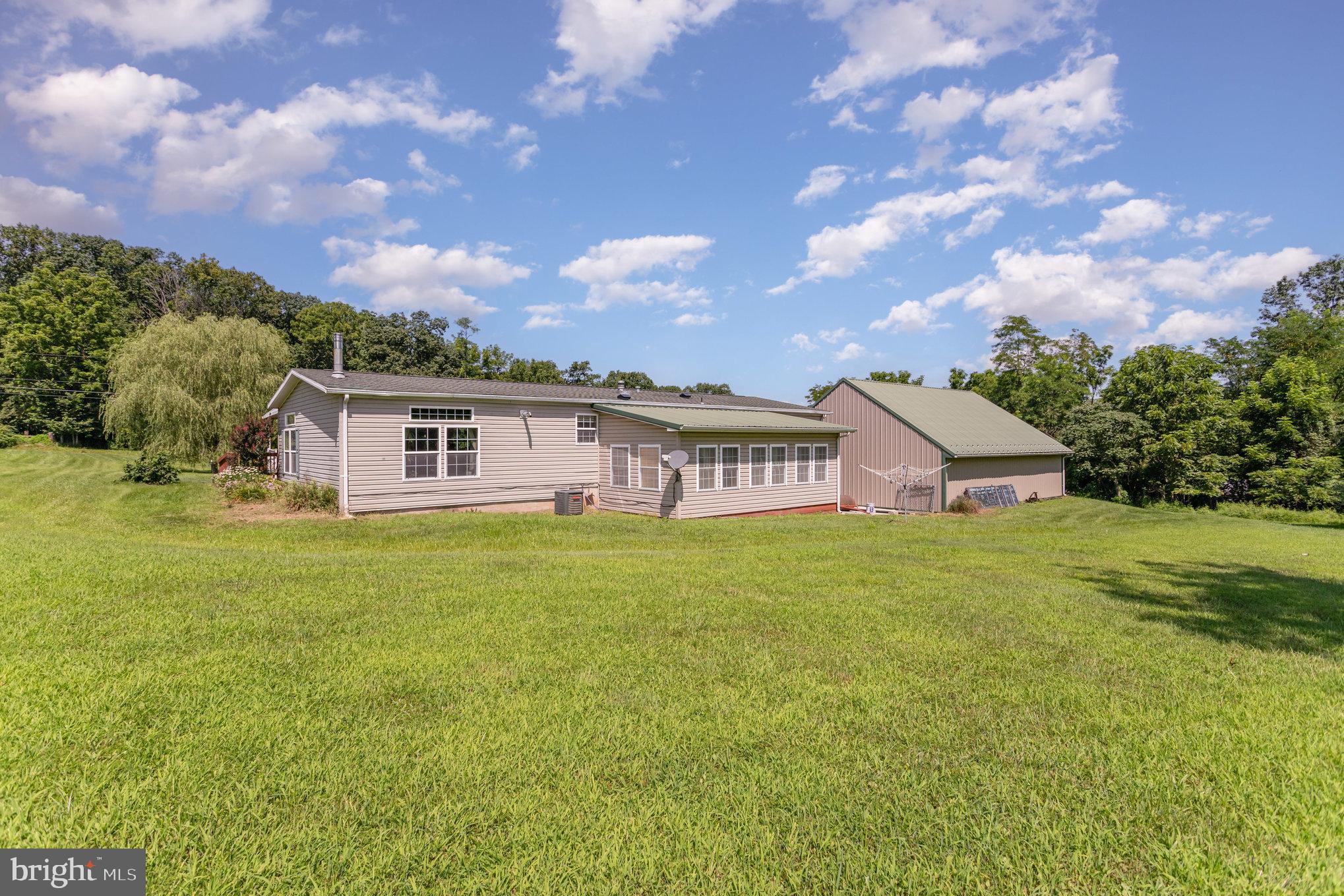 1050 Lisburn Road Wellsville, PA 17365 - Photo 28 of 35 a front view of a house with a garden