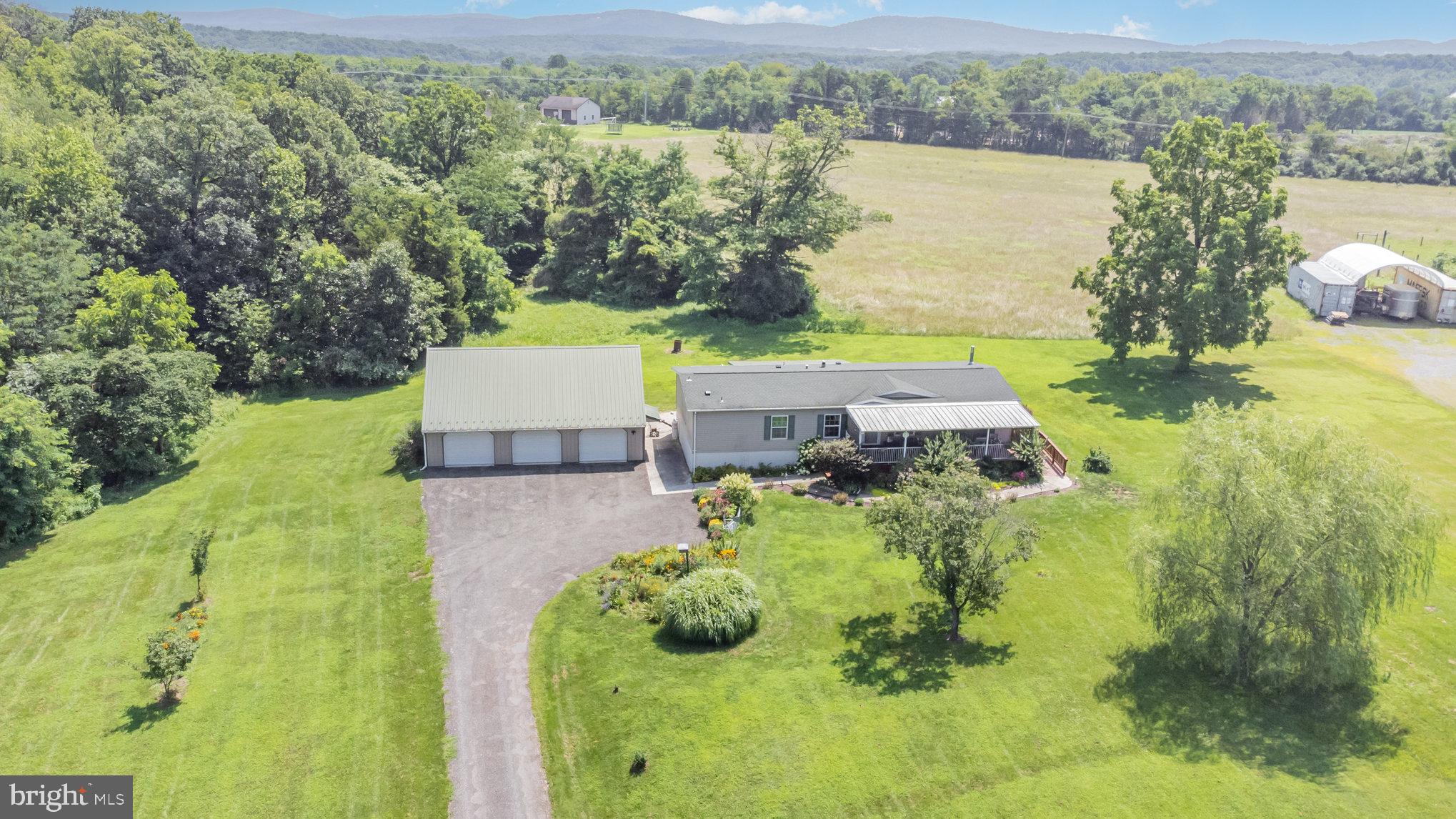1050 Lisburn Road Wellsville, PA 17365 - Photo 32 of 35 an aerial view of a house with yard swimming pool and outdoor seating