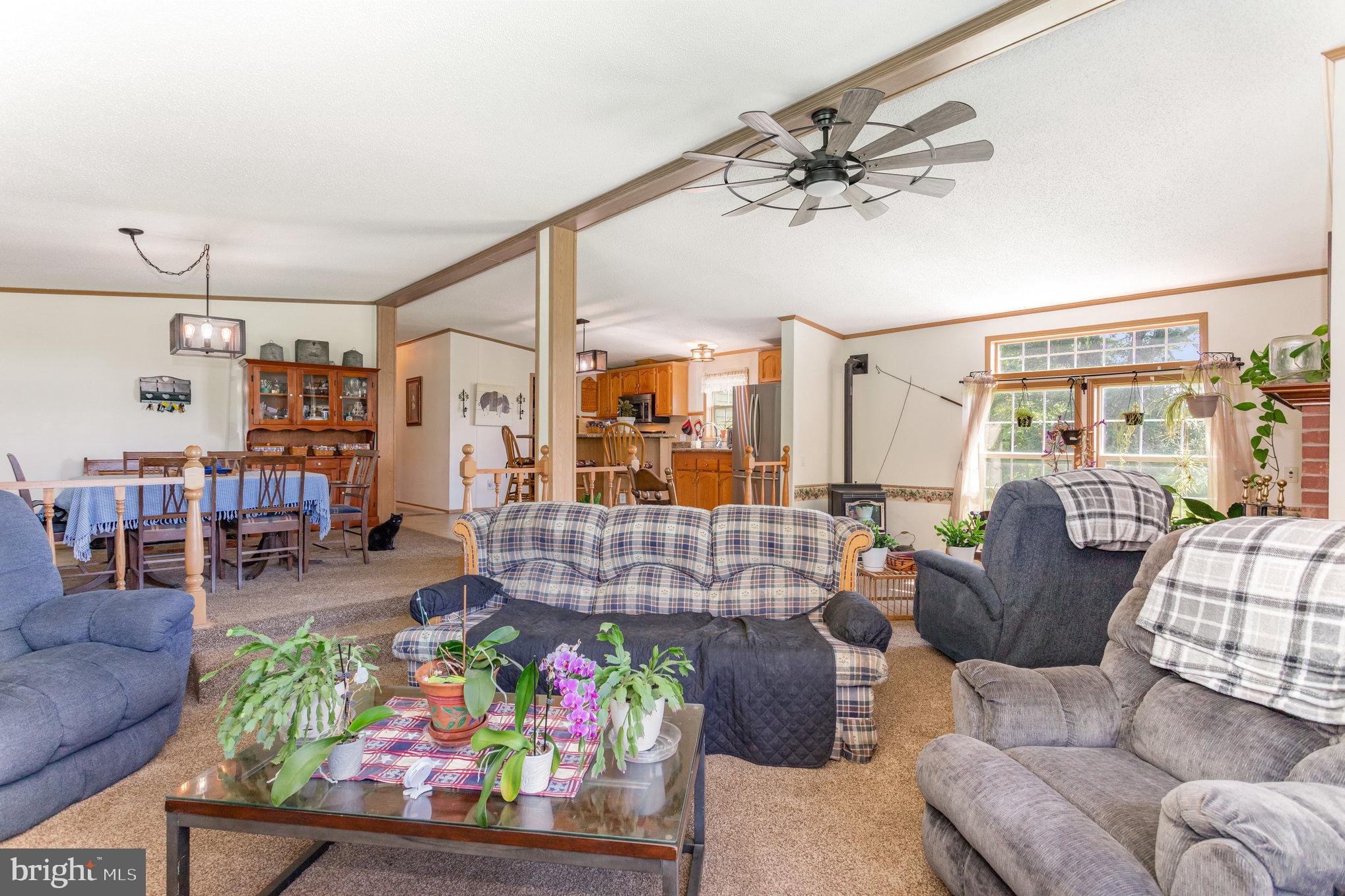1050 Lisburn Road Wellsville, PA 17365 - Photo 7 of 35 a living room with furniture and a chandelier