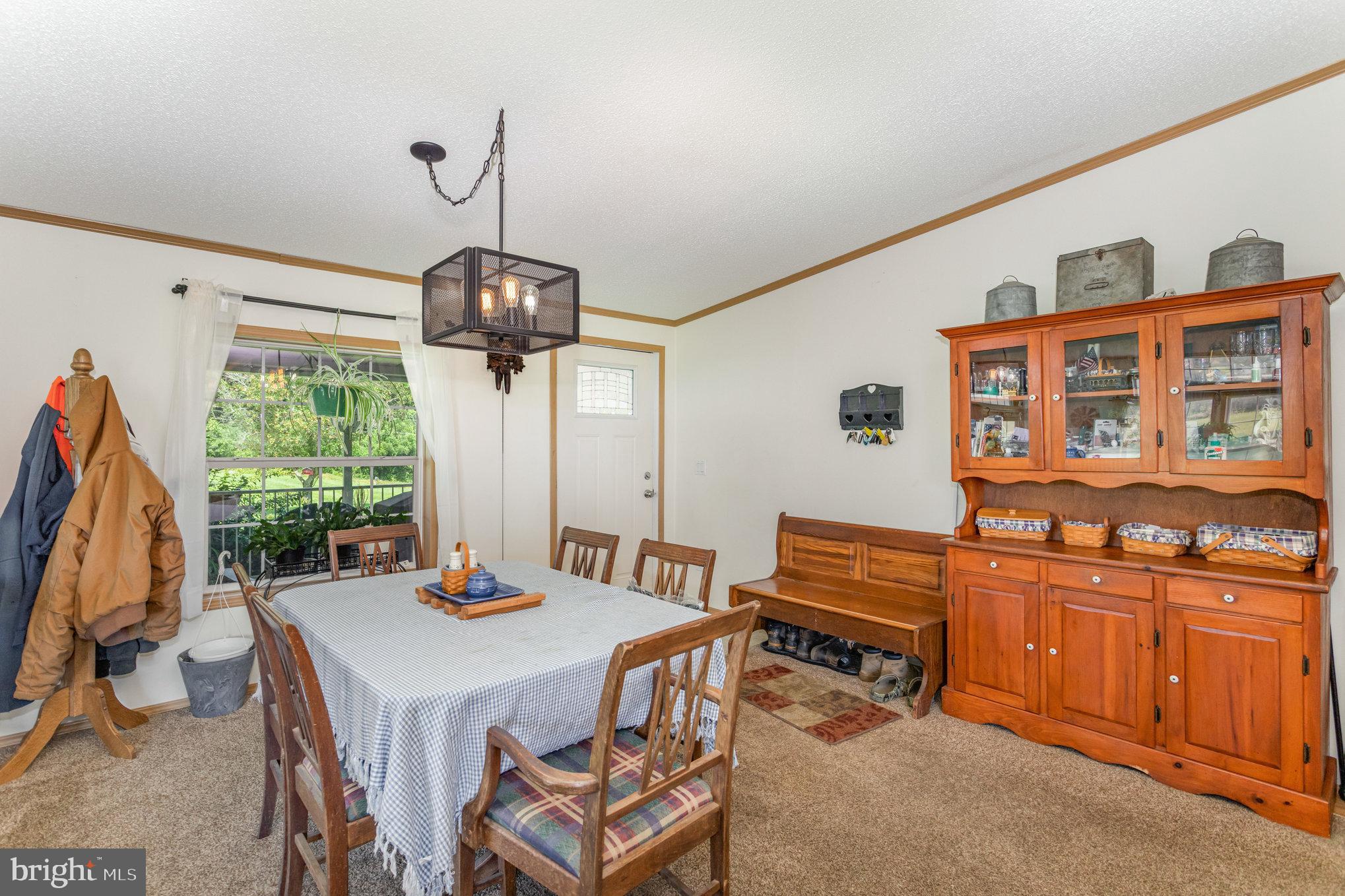 1050 Lisburn Road Wellsville, PA 17365 - Photo 9 of 35 a dining room with furniture a chandelier and window