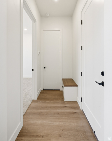 4978 North 75 East Enoch, UT 84721 - Photo 16 of 60 Corridor featuring light wood-style flooring and baseboards