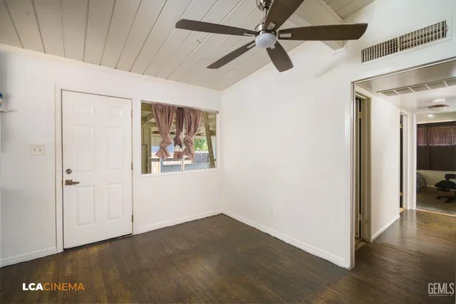 a view of a hallway with a white walls
