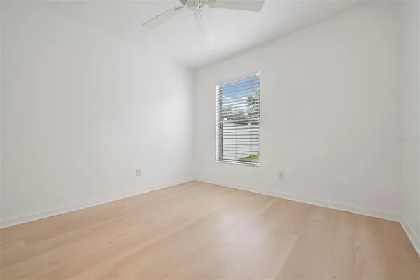 a view of an empty room with a window