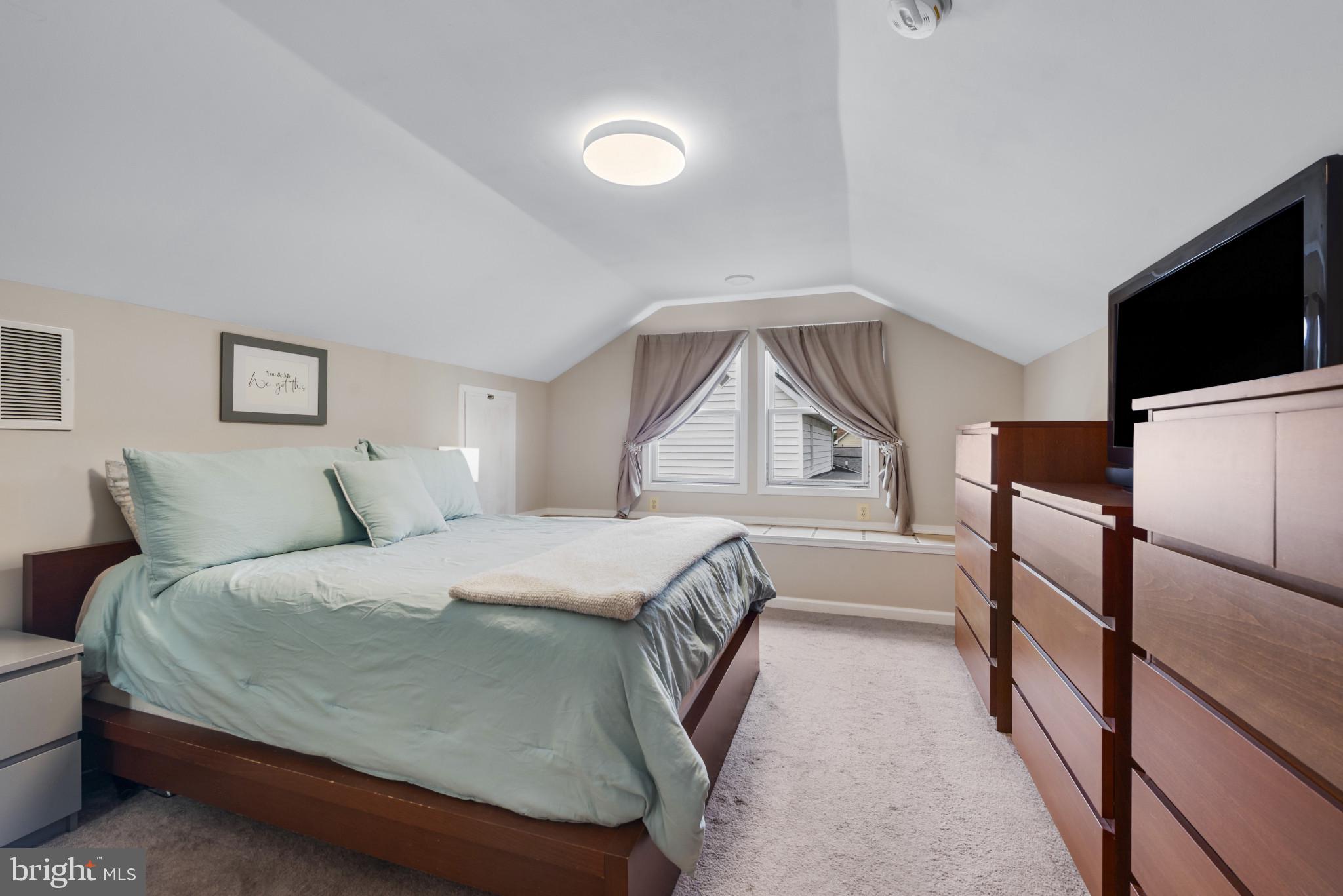 332 Poplar Road Baltimore, MD 21221 - Photo 32 of 59 a bedroom with a bed and a flat screen tv