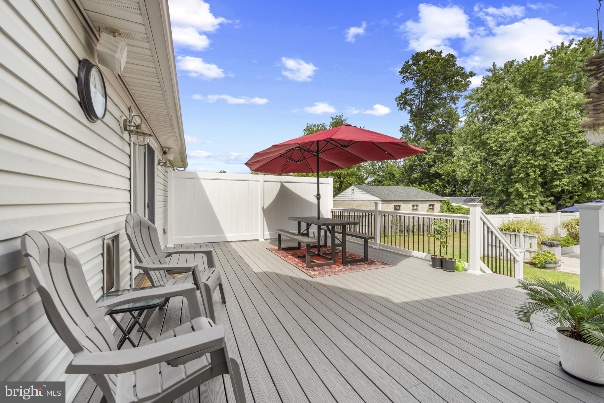 332 Poplar Road Baltimore, MD 21221 - Photo 46 of 59 a view of balcony with wooden floor and outdoor seating