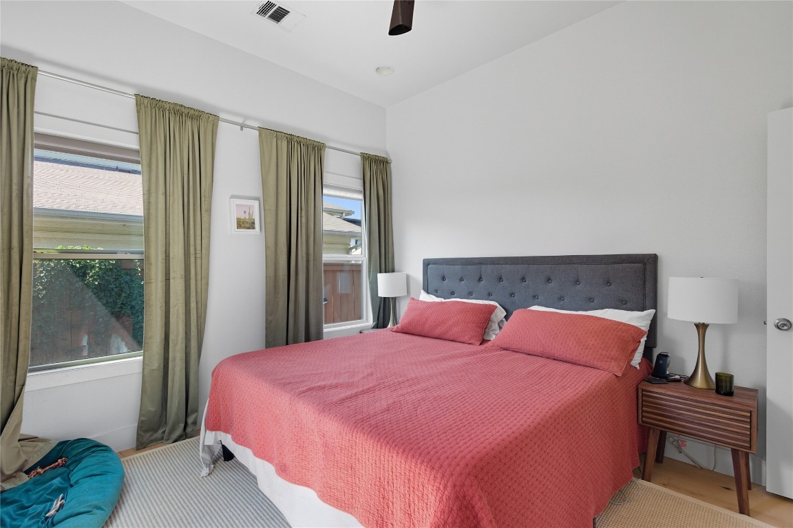 2007 South L Davis Avenue, Unit B Austin, TX 78702 - Photo 11 of 24 a bedroom with a bed and wooden floor