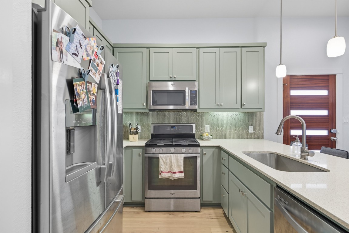 2007 South L Davis Avenue, Unit B Austin, TX 78702 - Photo 15 of 24 a kitchen with stainless steel appliances granite countertop a stove and a refrigerator
