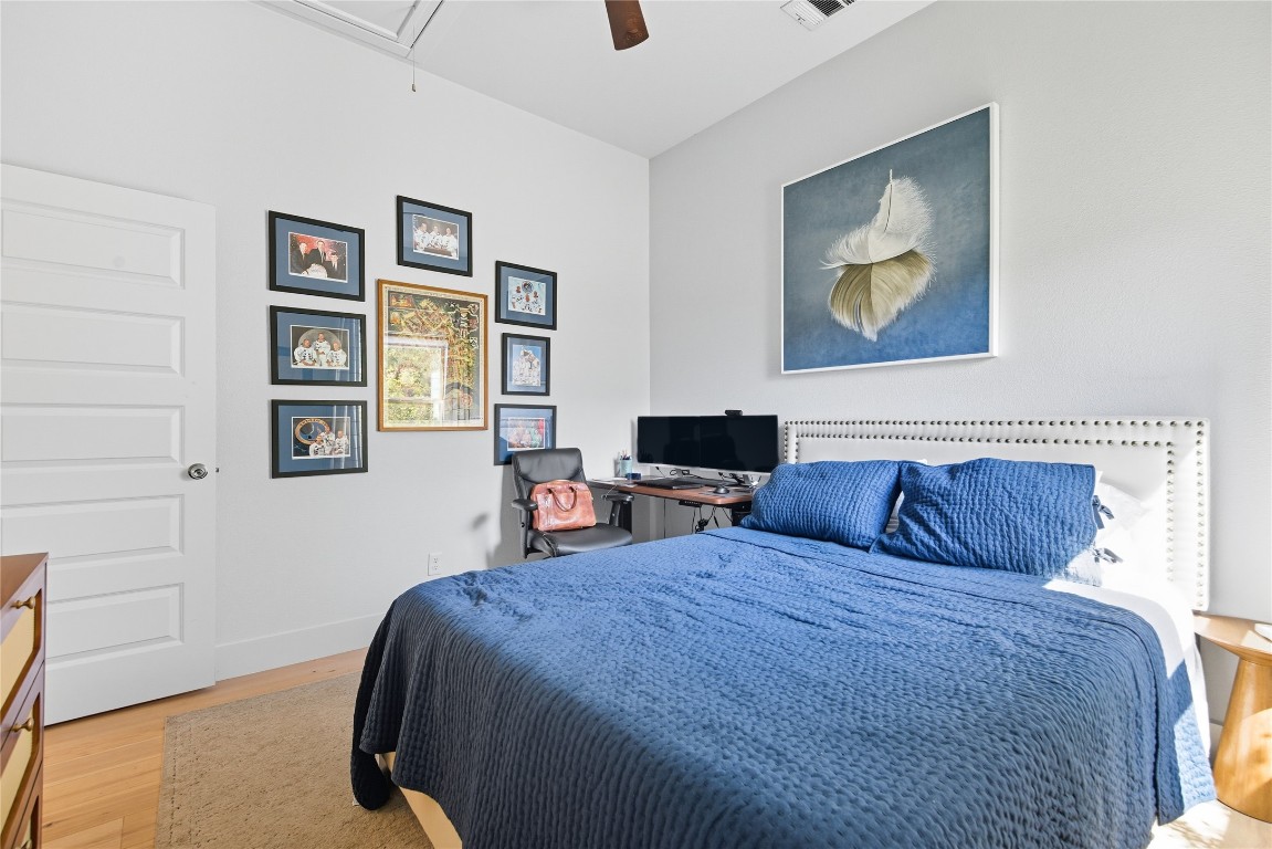 2007 South L Davis Avenue, Unit B Austin, TX 78702 - Photo 18 of 24 a bedroom with a bed and a painting on the wall