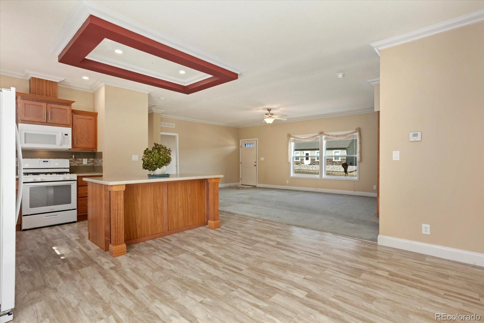 655 Quarry Station Poncha Springs, CO 81242 - Photo 11 of 41 a kitchen with stainless steel appliances granite countertop a stove and a refrigerator