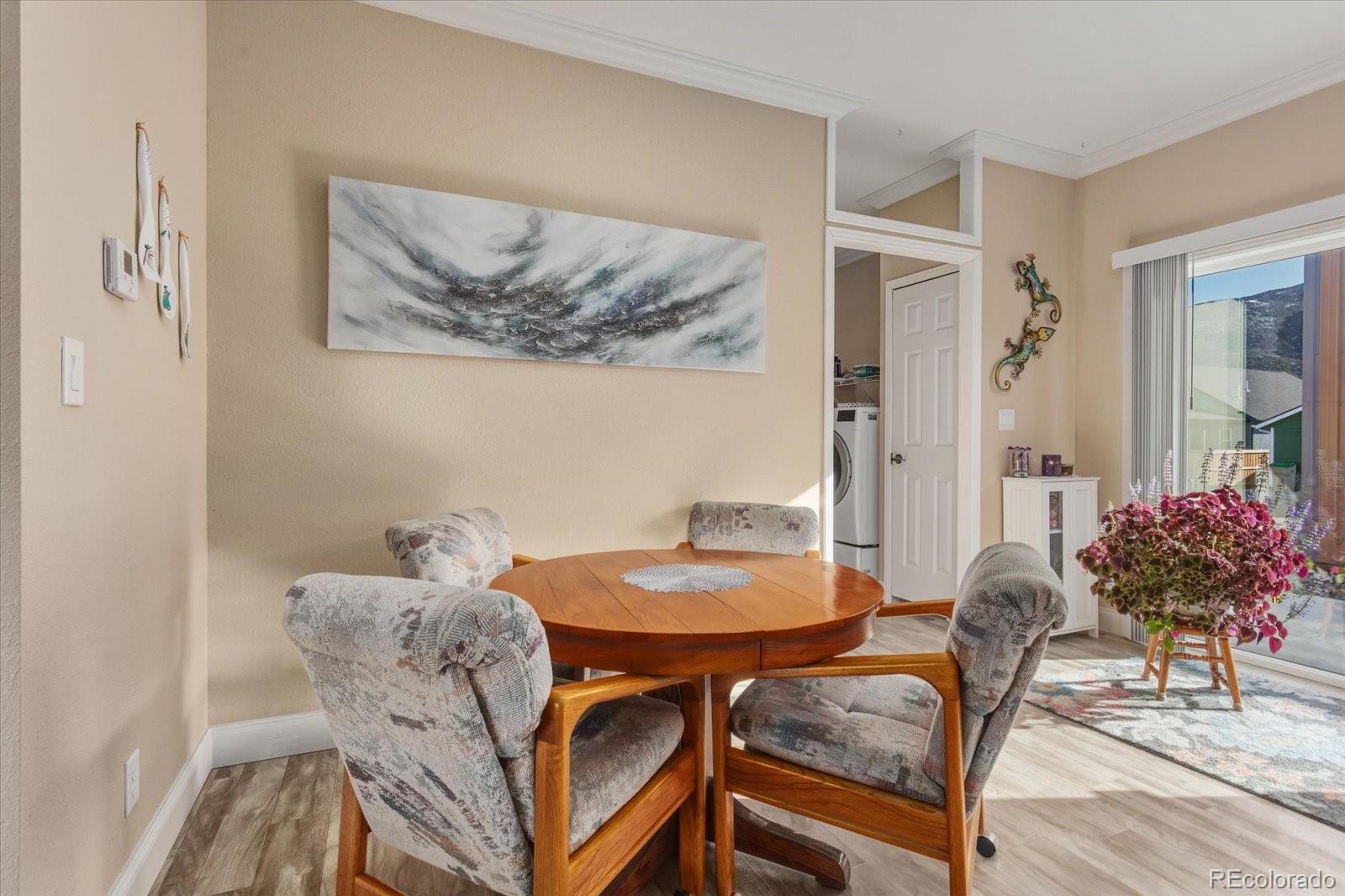 655 Quarry Station Poncha Springs, CO 81242 - Photo 12 of 42 a view of a dining room with furniture and wooden floor