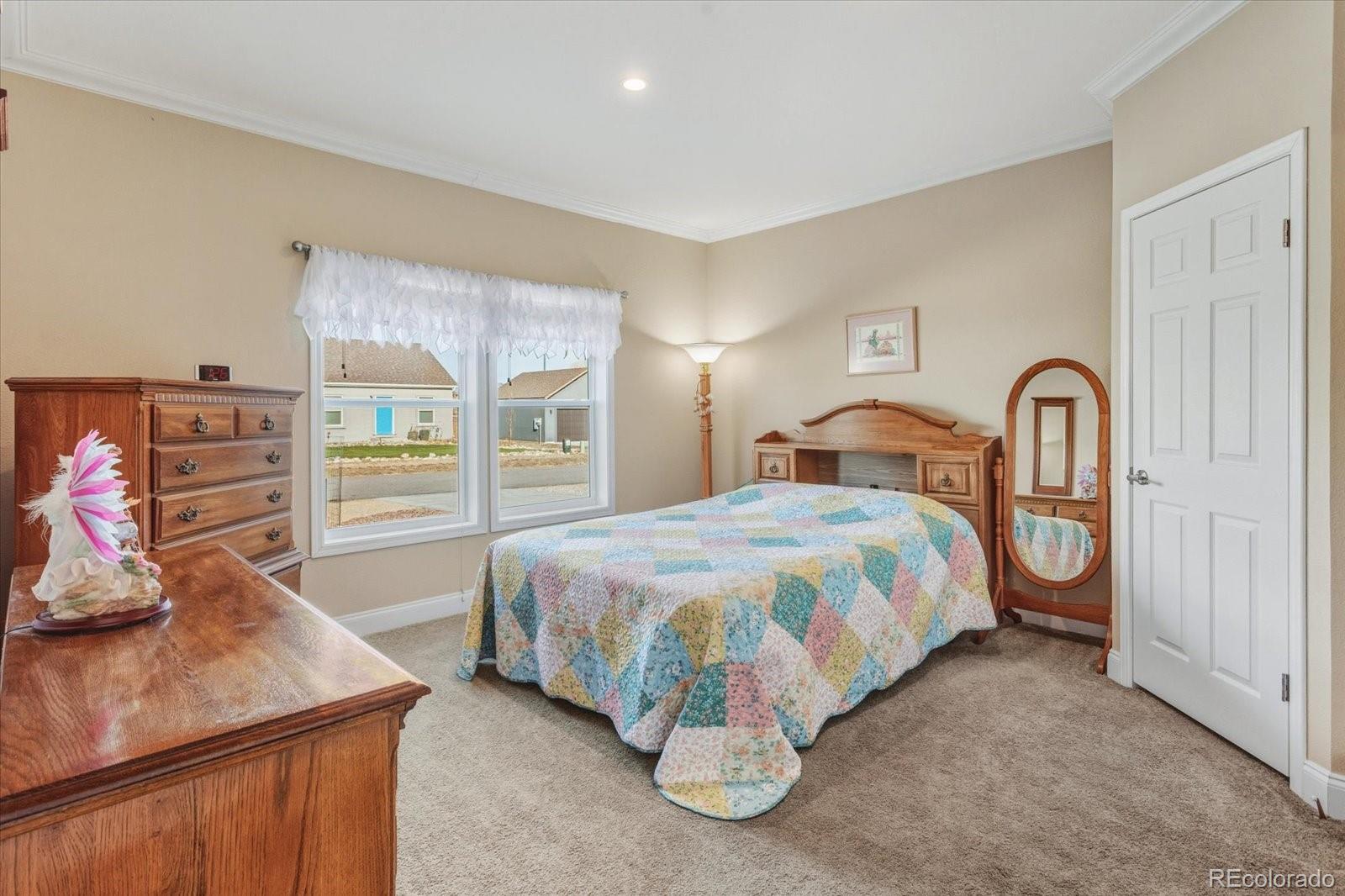 655 Quarry Station Poncha Springs, CO 81242 - Photo 13 of 42 a bedroom with a bed and a dresser