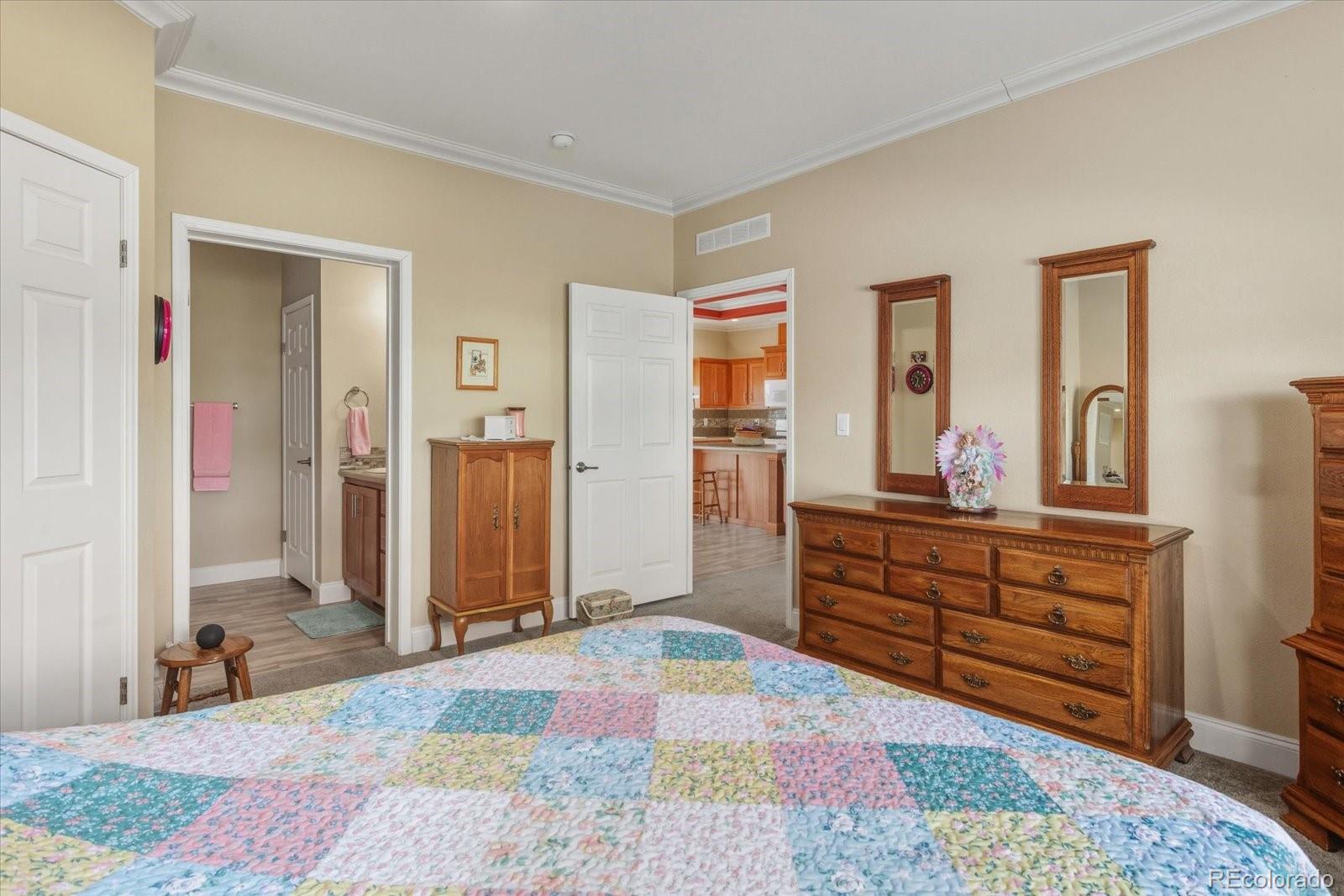 655 Quarry Station Poncha Springs, CO 81242 - Photo 14 of 42 a bed room with a bed and a dresser