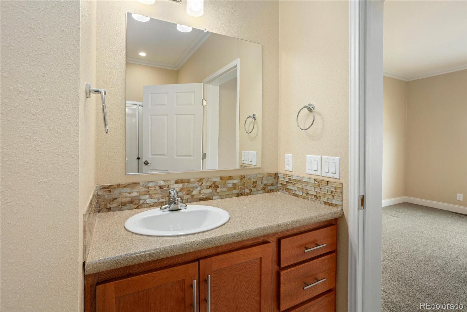 655 Quarry Station Poncha Springs, CO 81242 - Photo 14 of 41 a bathroom with a sink and a mirror