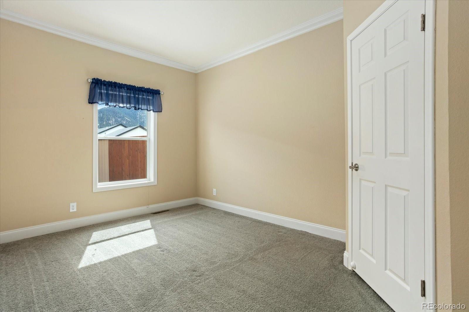 655 Quarry Station Poncha Springs, CO 81242 - Photo 17 of 41 an empty room with windows