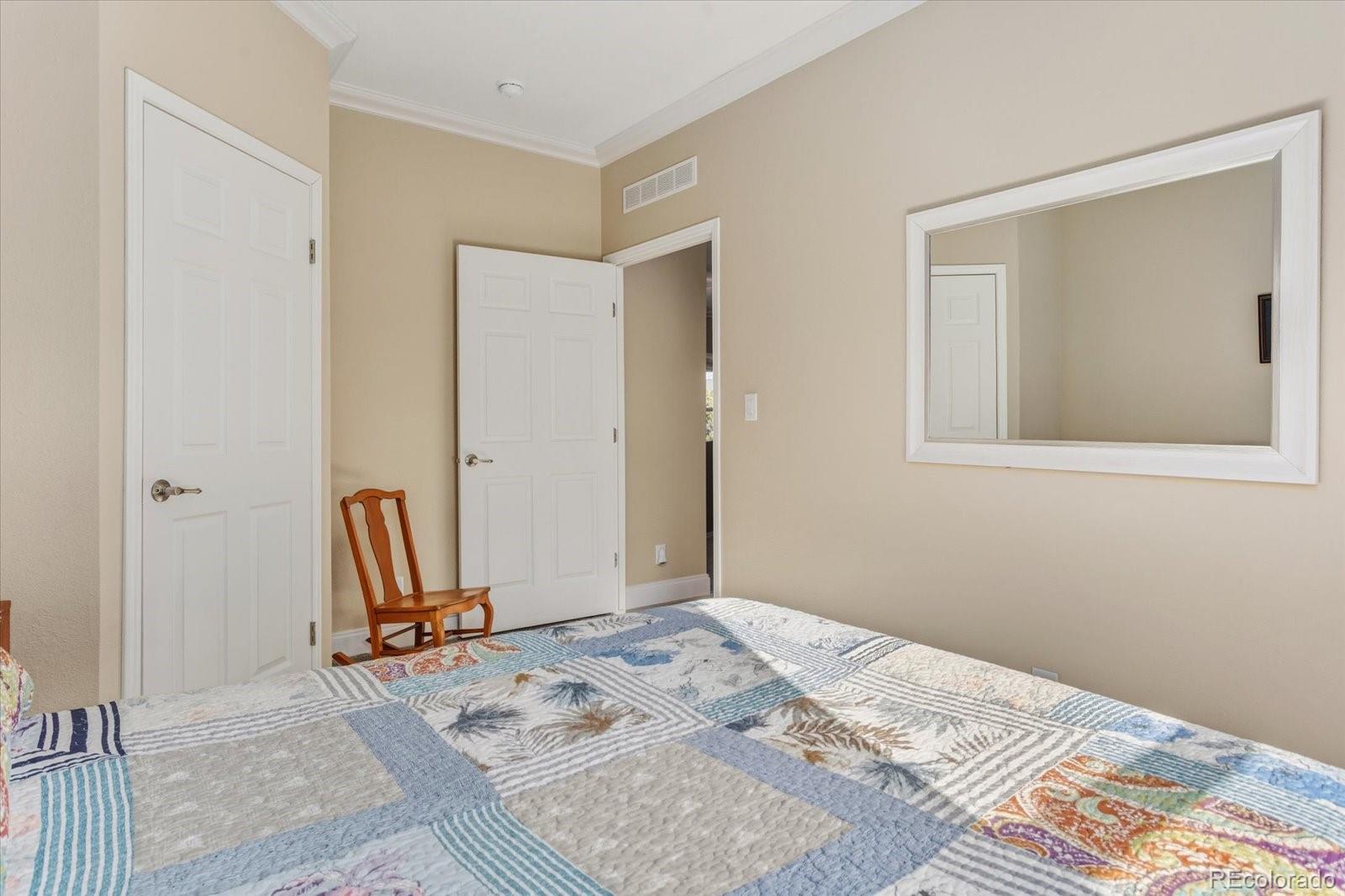 655 Quarry Station Poncha Springs, CO 81242 - Photo 19 of 42 a view of a bedroom with a bed and wooden floor