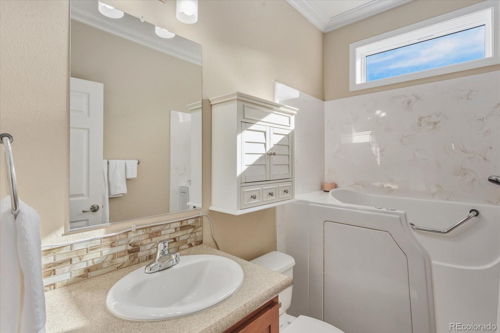 655 Quarry Station Poncha Springs, CO 81242 - Photo 20 of 42 a bathroom with a sink toilet and mirror