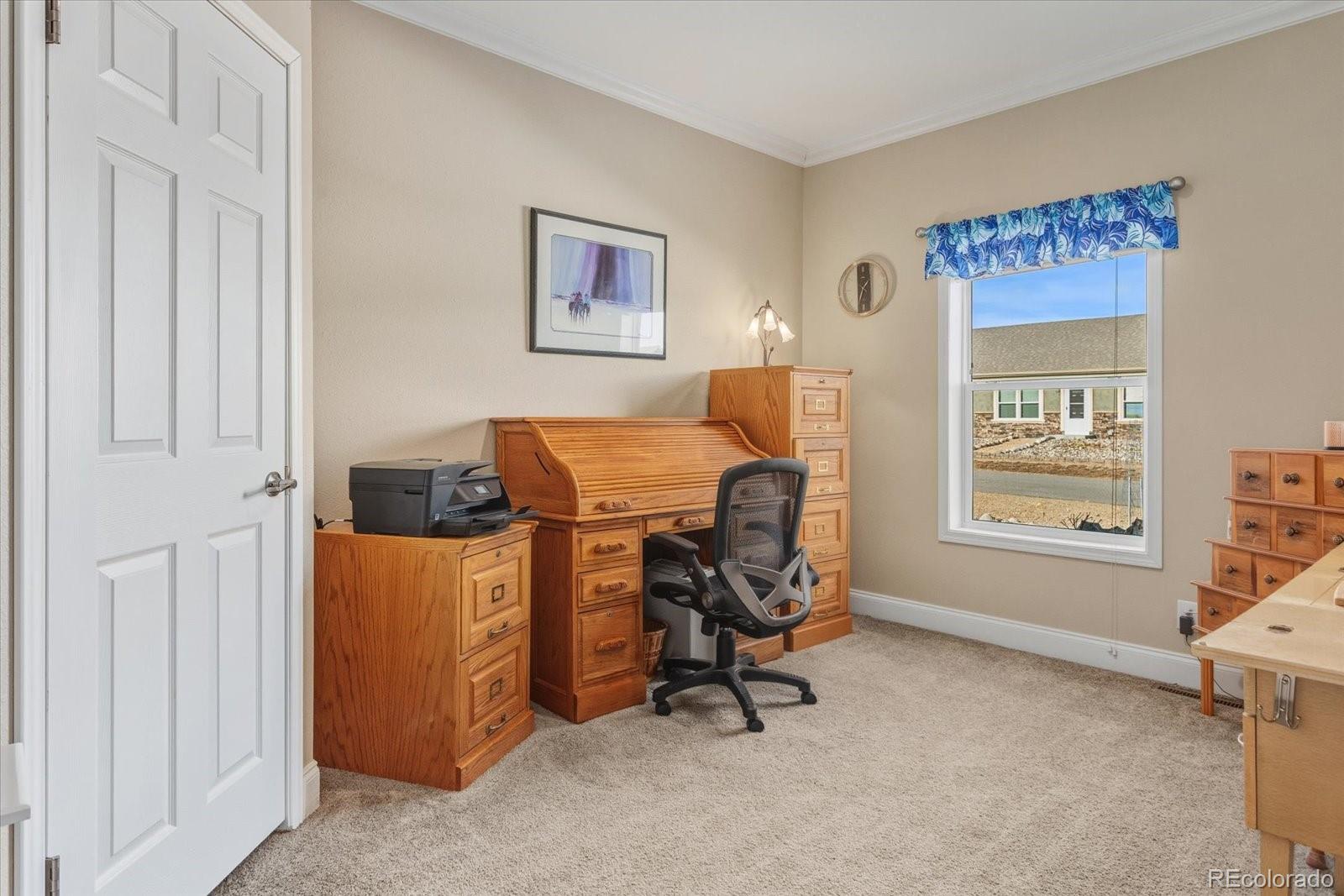 655 Quarry Station Poncha Springs, CO 81242 - Photo 22 of 42 a view of a workspace with furniture and a window