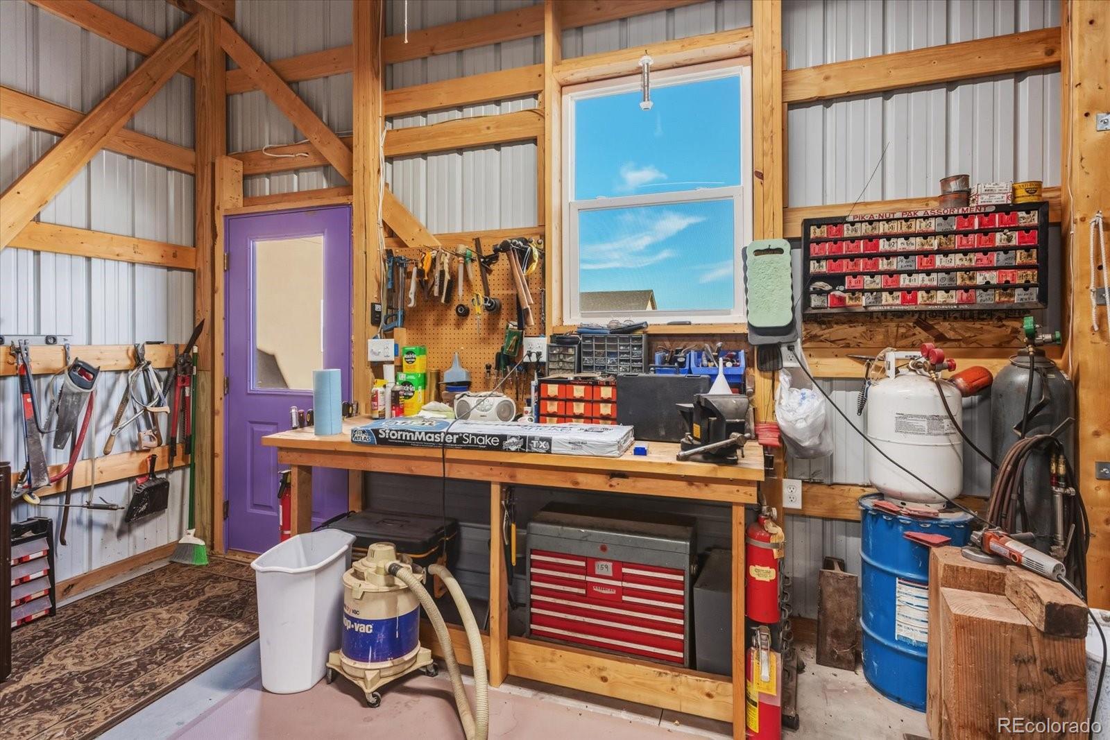 655 Quarry Station Poncha Springs, CO 81242 - Photo 37 of 42 a view of walk in closet with clothes and shoes