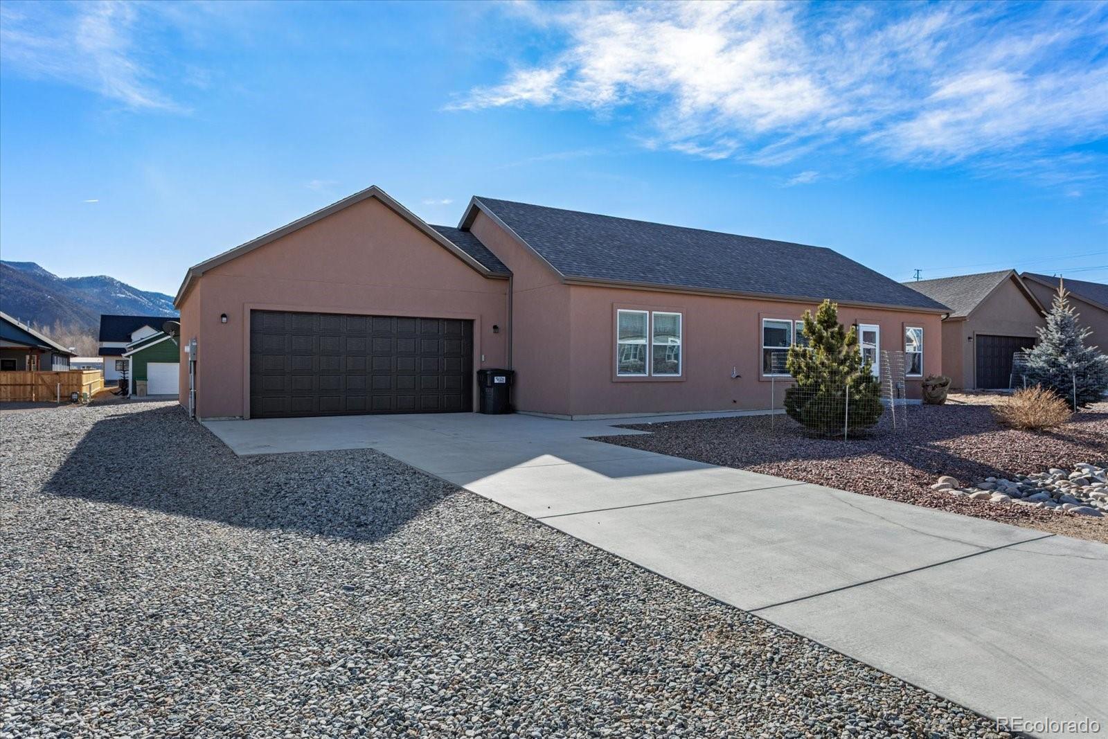655 Quarry Station Poncha Springs, CO 81242 - Photo 38 of 41 a front view of a house with a yard and garage